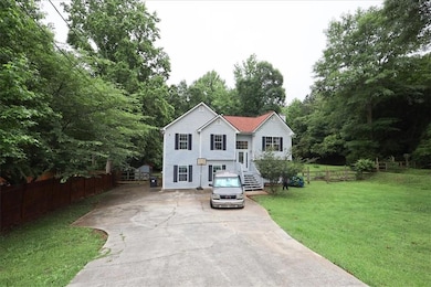 Bi-level home with concrete driveway
