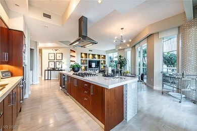 Kitchen featuring island exhaust hood, stainless s