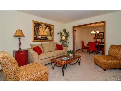 Formal living room with new carpet, fresh paint. T
