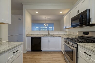 New granite counter tops, white cabinets including