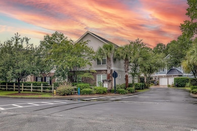View of property at dusk