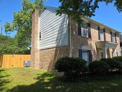 This is a charming two-story brick home with elega