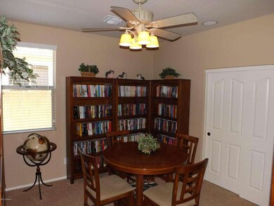 ONE OF THREE BEDROOMS USED AS LIBRARY