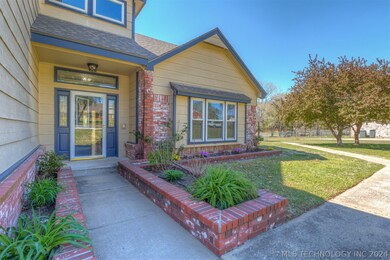 Professional brick flowerbeds in front with low ma