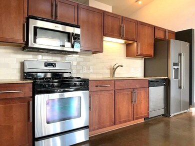Kitchen featuring appliances with stainless steel