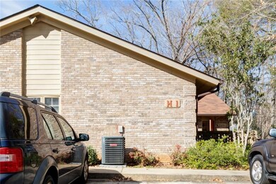 View of property exterior featuring brick siding a