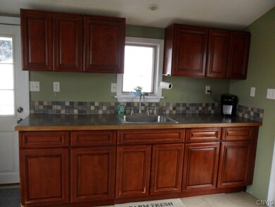 KITCHEN, SHOWING SIDE ENTRY