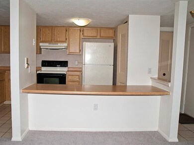 Kitchen with built-in table and open to living are