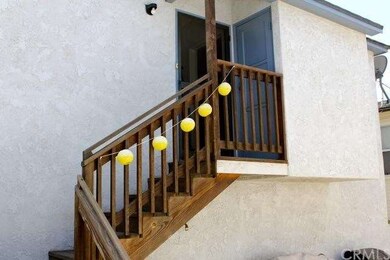 Stairs leading to back unit that sits over the gar