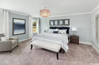 Bedroom with a chandelier, baseboards, carpet floo