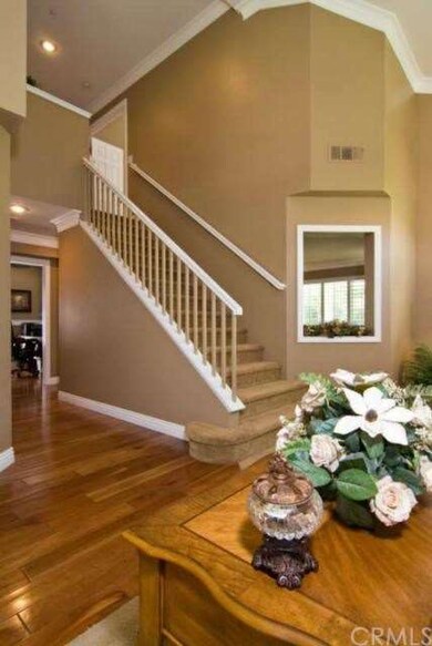 Stairway to 4 bedrooms upstairs.  Open area to fam