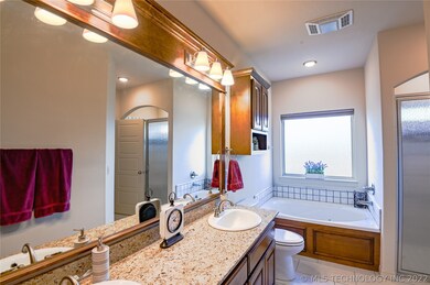 first full bath, double vanity, tub and shower