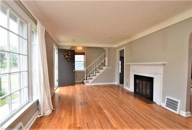 Spacious Living Room with hardwood floors.