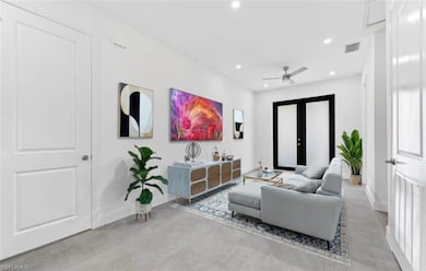 Living room with recessed lighting and a ceiling fan
