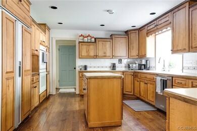 The over-sized kitchen features abundant cabinetry