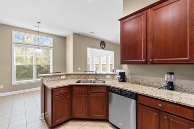 Kitchen with light tile patterned floors, light st