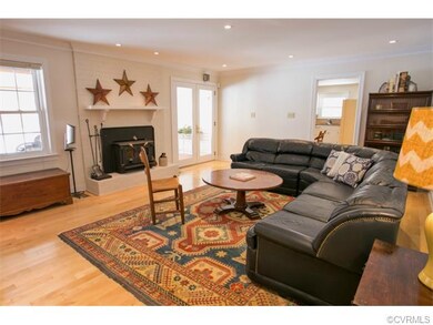 Family room central to home, wood burning insert.