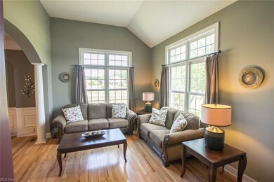 Off the foyer to the right is the living room with newer hardwood floors.