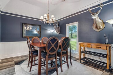 Dining room featuring ornamental molding and an in