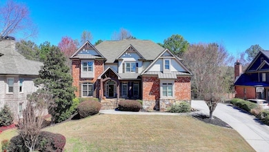 View of front of home with brick siding, a standin