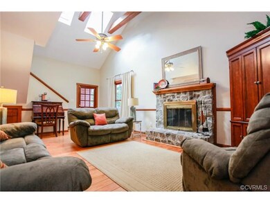 Larger living area with cathedral ceiling, wood be