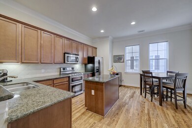 Granite counters, tons of storage, gleaming hardwo
