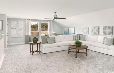 Living room with light carpet, vaulted ceiling, an