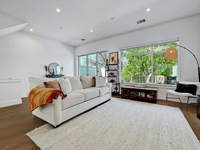 Living room featuring dark wood-type flooring, vi