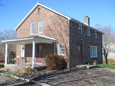 Exterior Front. Side cement covered patio.