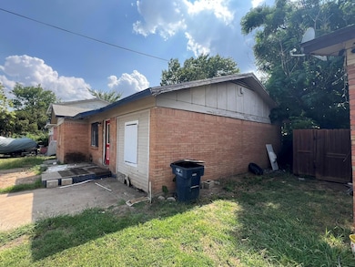 View of property exterior featuring a yard