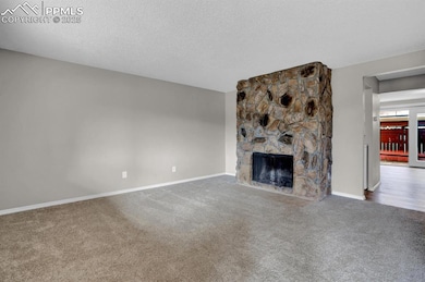 Unfurnished living room featuring carpet flooring,