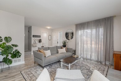 Living room featuring light hardwood / wood-style 