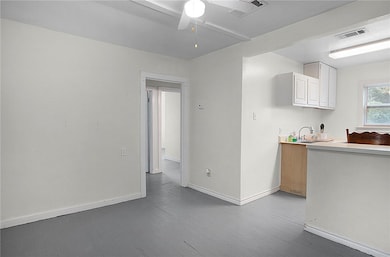 Kitchen featuring dark wood-type flooring, visible