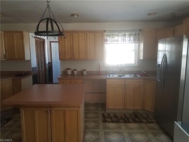Plenty of cabinets in the Kitchen plus Island