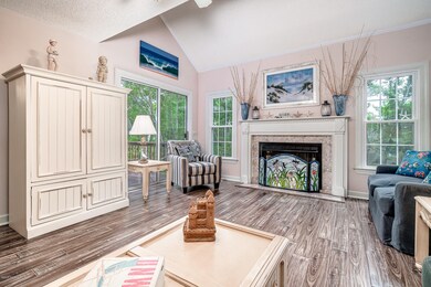 Vaulted living room w/ fireplace