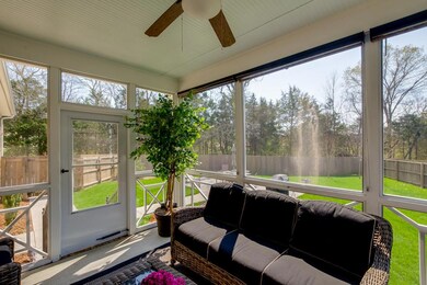 Enjoy this relaxing screened-in porch.  Move in and relax! No stress of building.
