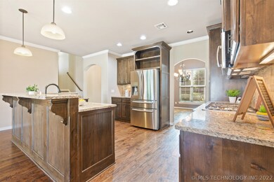 Large Open Kitchen features granite countertops an