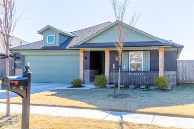 View of front of property featuring a garage and covered porch