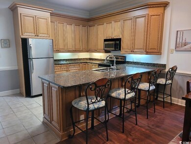 Kitchen with ornamental molding, appliances with s