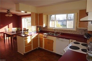 Bright sunny kitchen opens to the dining area. New