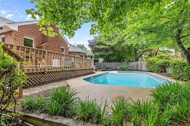 Back yard Retreat with salt water pool, tiered deck with covered area.