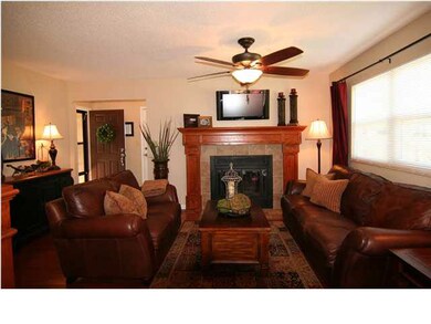 Living room fireplace has new hearth, mantle, tile