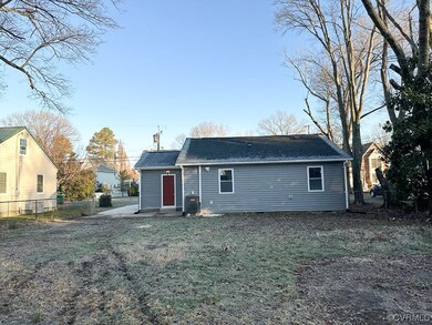 Rear view of property with central air condition u