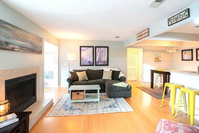 Living room open to sunroom and kitchen