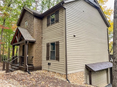 View of side of home featuring a garage