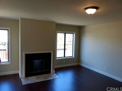 Family Room With Fireplace And New Flooring