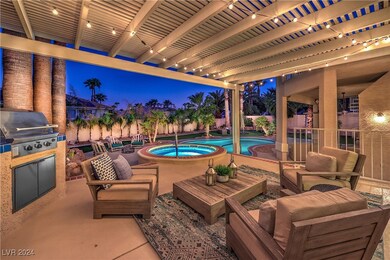 Surrounded by mature palm trees, the backyard oasi