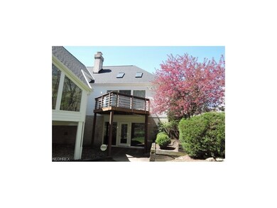 View of back with walk out basement