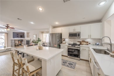 Kitchen with a sink, stainless steel appliances, v
