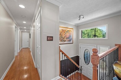 A hall leads to 3 bedrooms and 2 full baths.